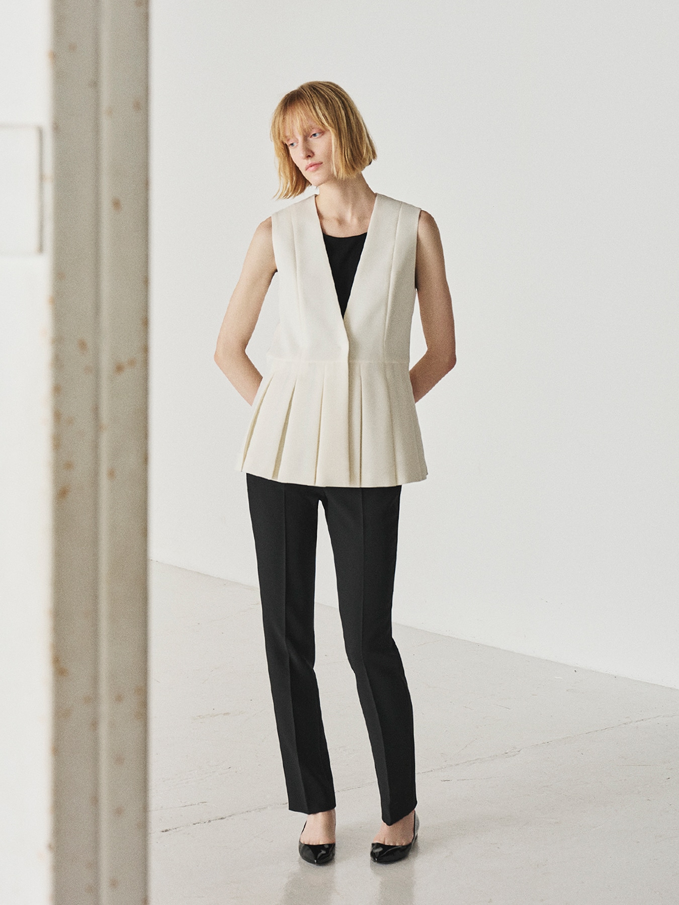 プリーツペプラムジレ